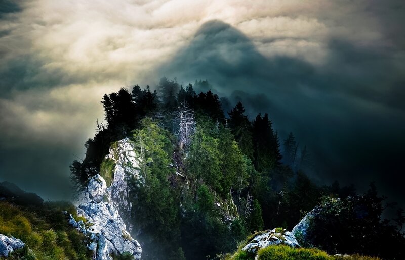 Mountain peak in misty clouds