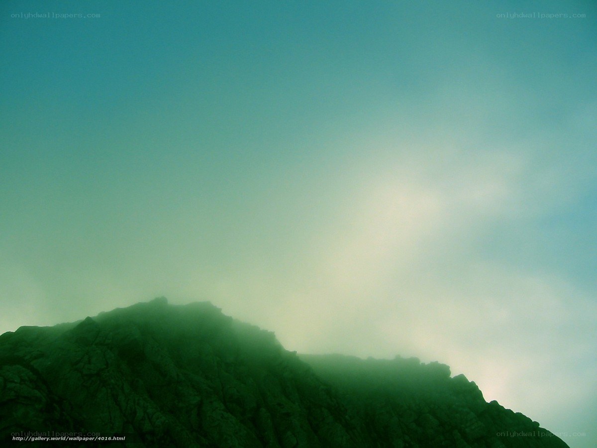 Mountain peak in misty light