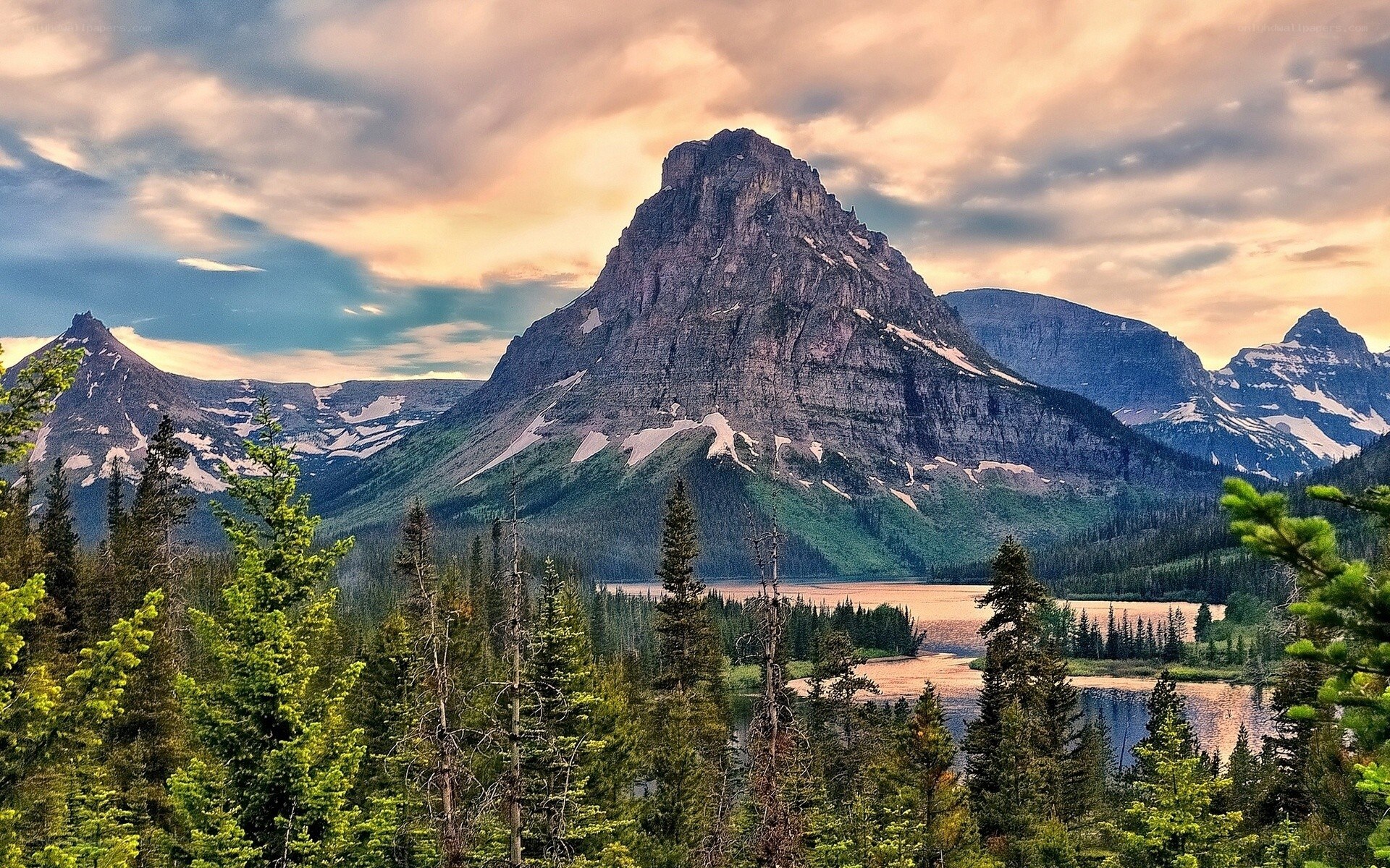 Mountain peak over forest lake