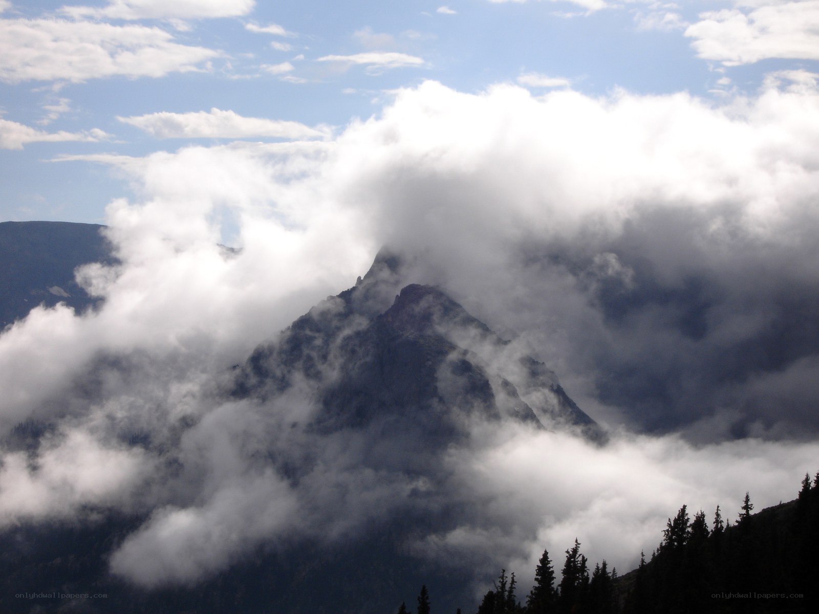 Mountain peak shrouded in clouds