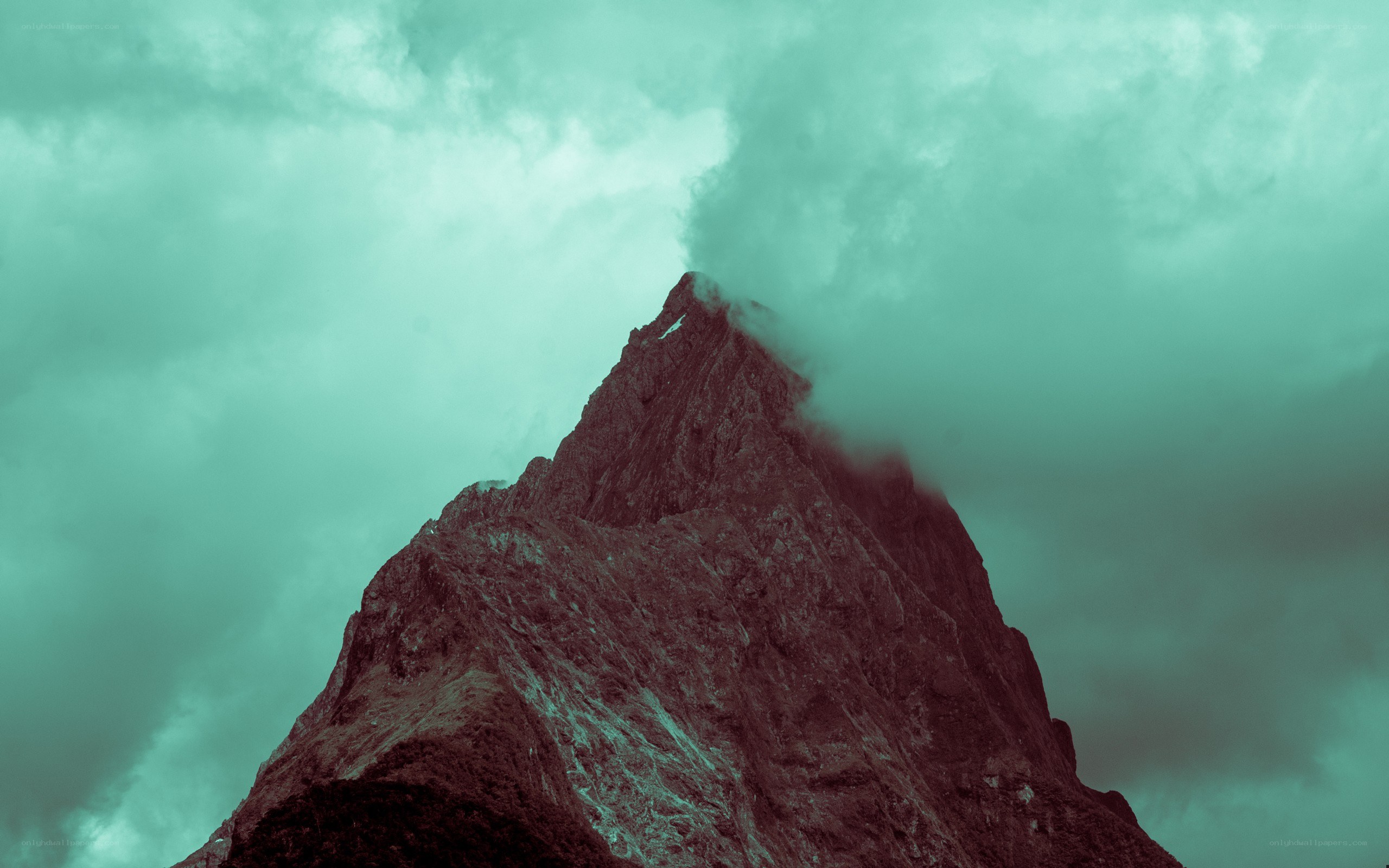 Mountain peak shrouded in clouds