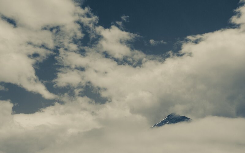 Mountain Peak Through Clouds — Blue, Dramatic