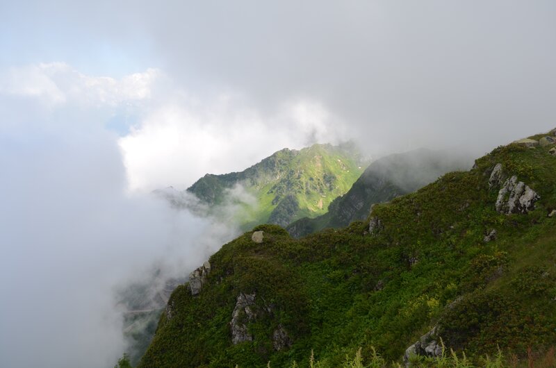 Mountain Peak Through Clouds — Green