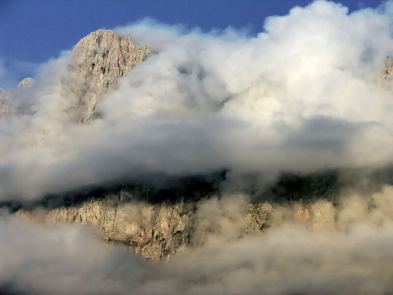 Mountain Peak Through Clouds — White