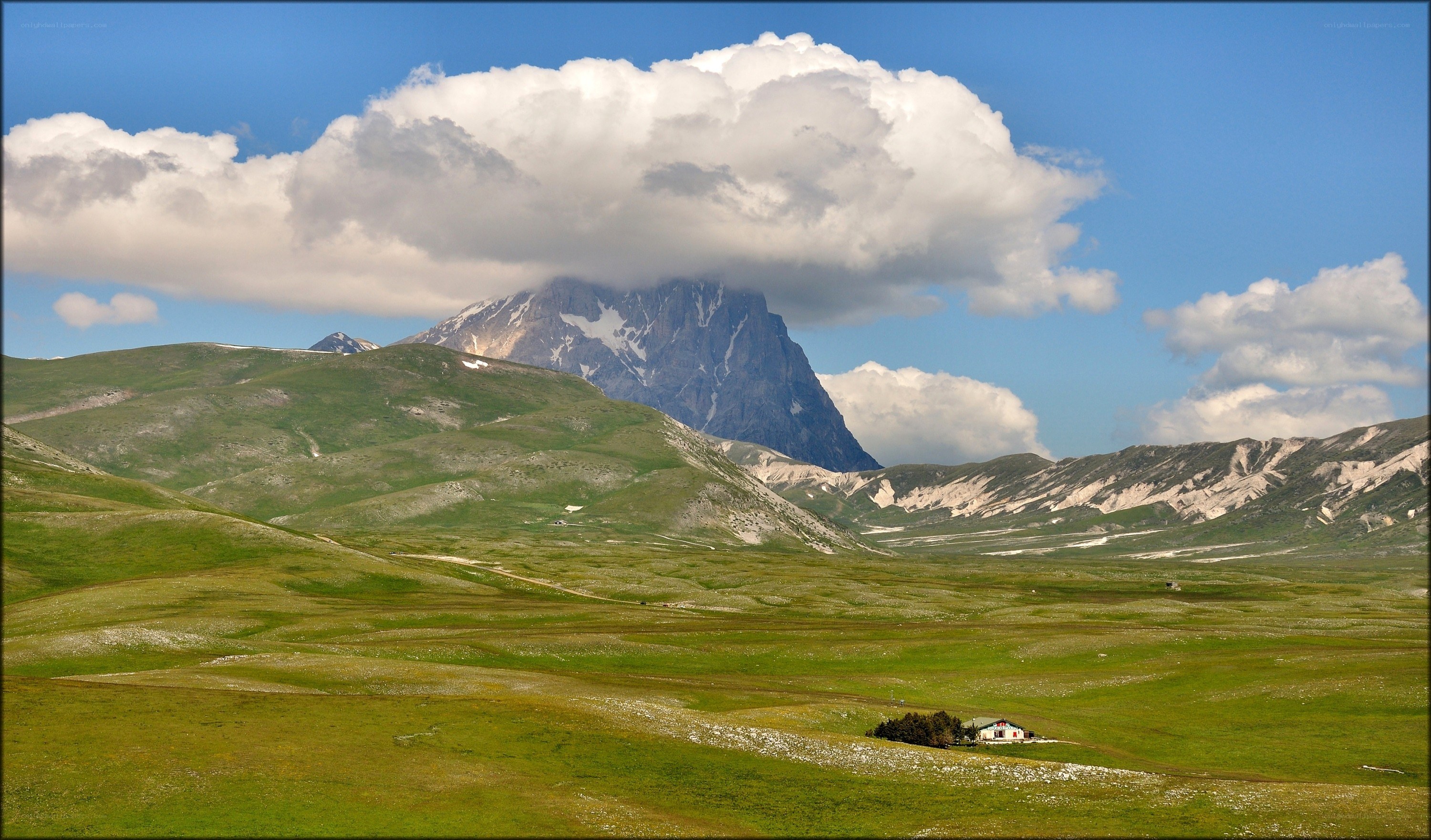 Mountain peak under a cloud