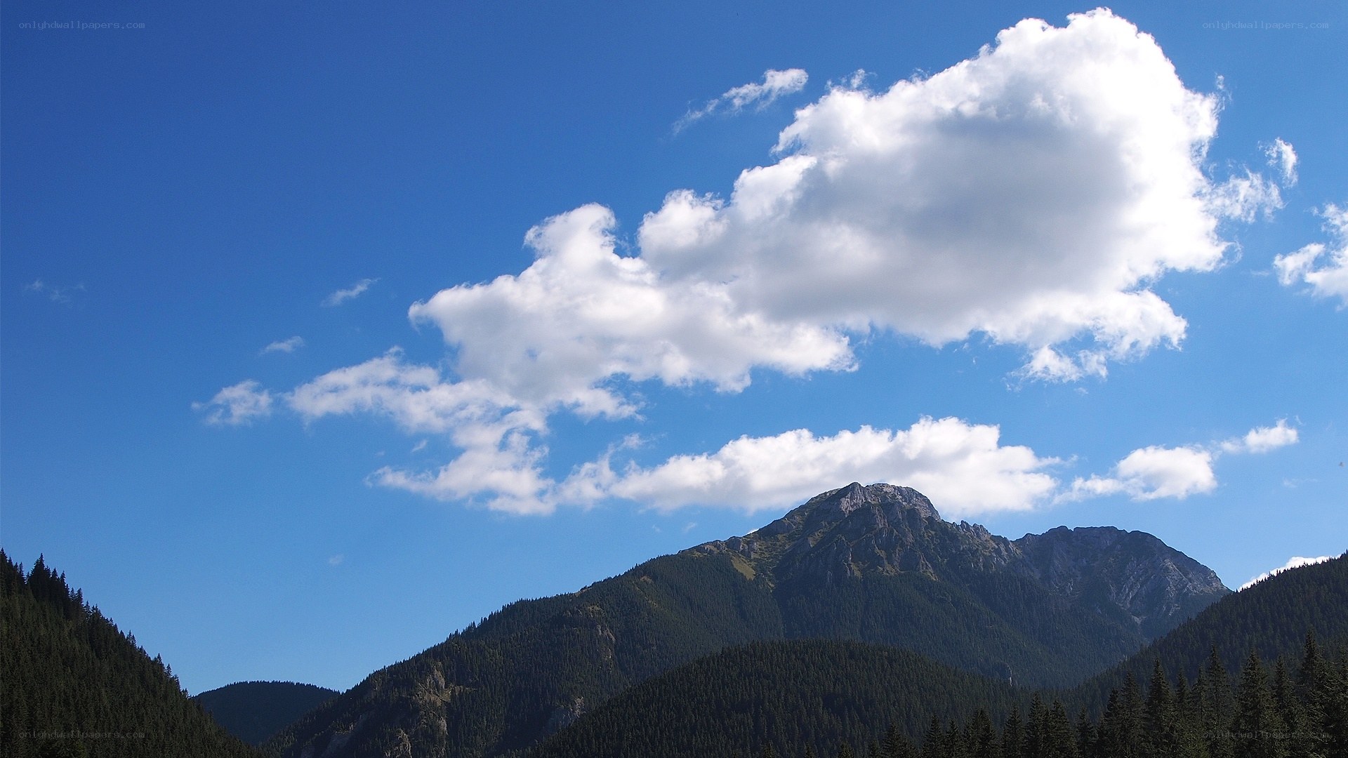 Mountain peak under blue sky