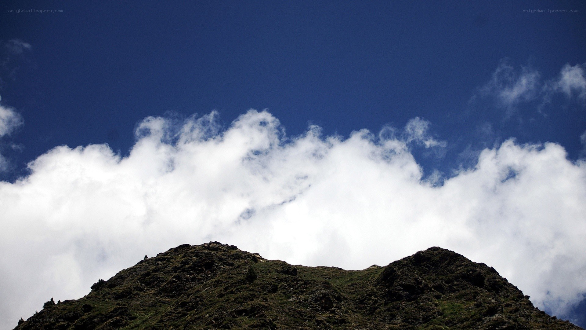 Mountain peak under blue sky