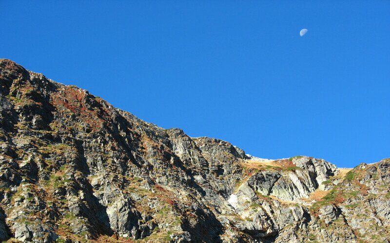 Mountain peak under blue sky