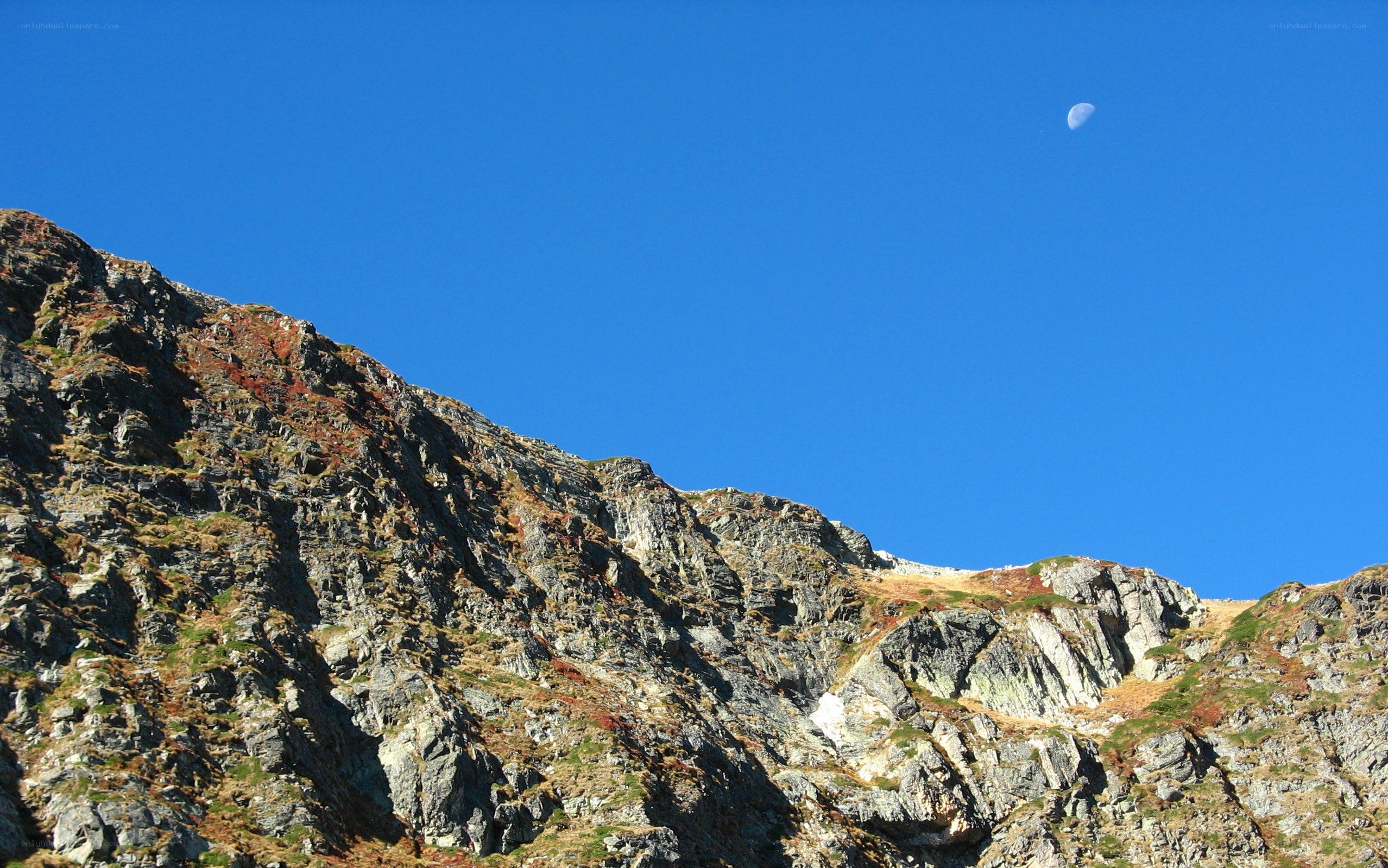 Mountain peak under blue sky