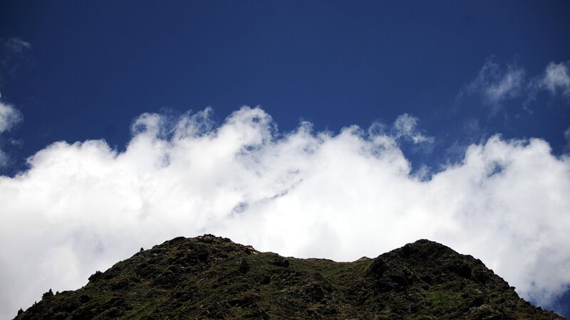 Mountain Peak under Clouds — Blue