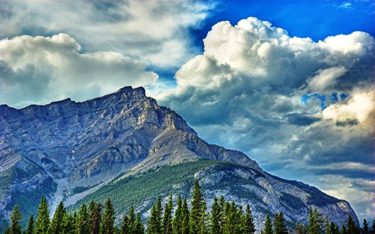 Mountain peak under cloudy sky