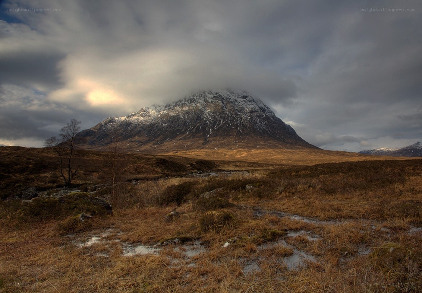 Mountain peak under cloudy sky