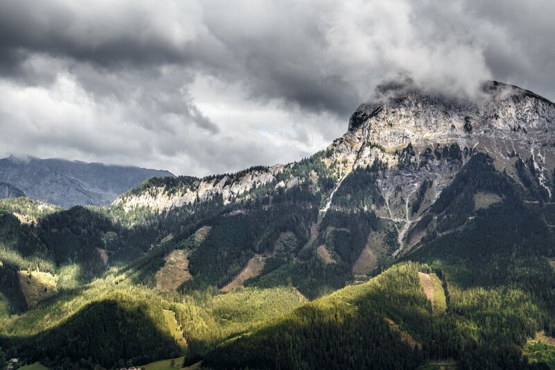 Mountain peak under stormy sky