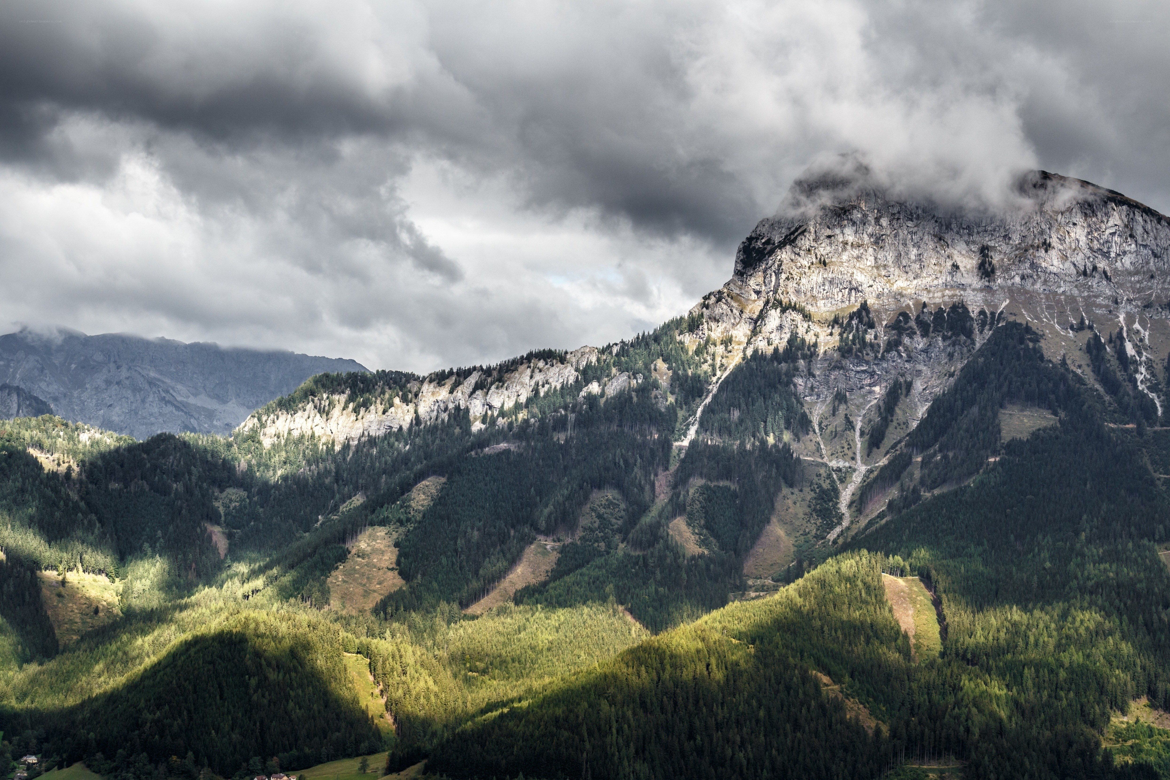 Mountain peak under stormy sky