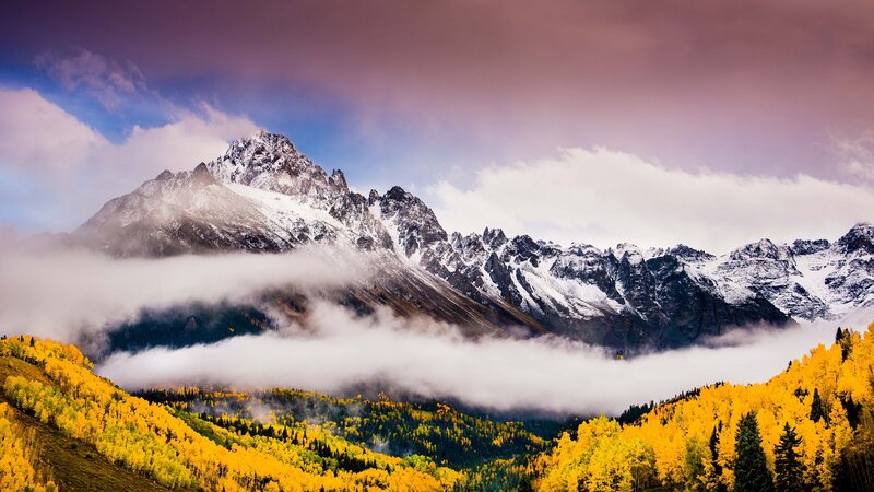 Mountain peak with autumn forest