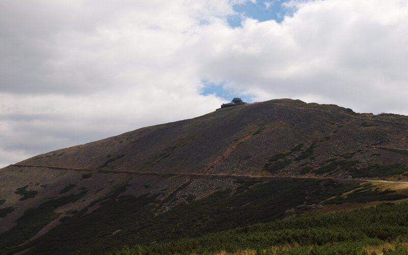 mountain peak with building