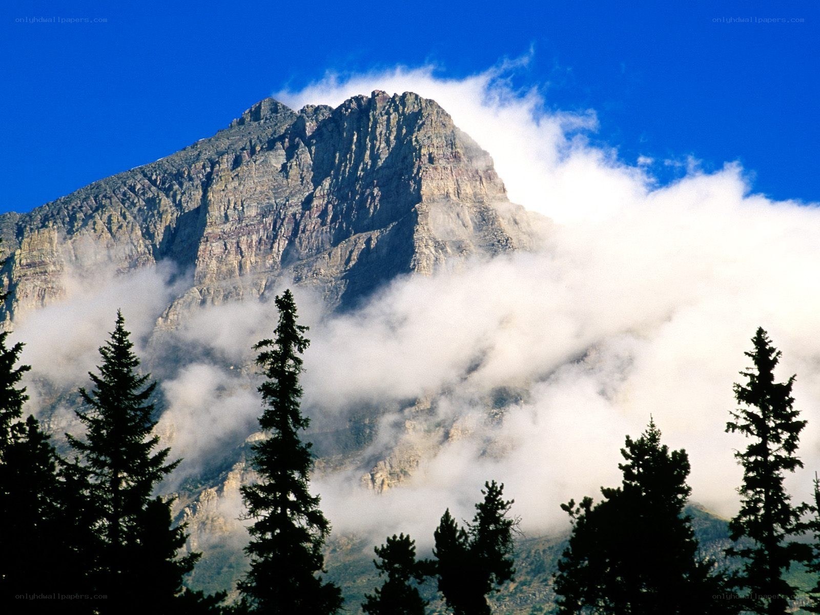 Mountain peak with clouds