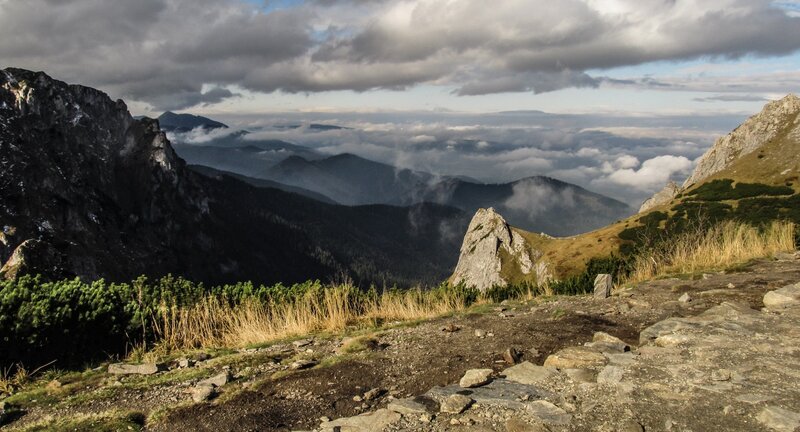 Mountain peak with clouds below