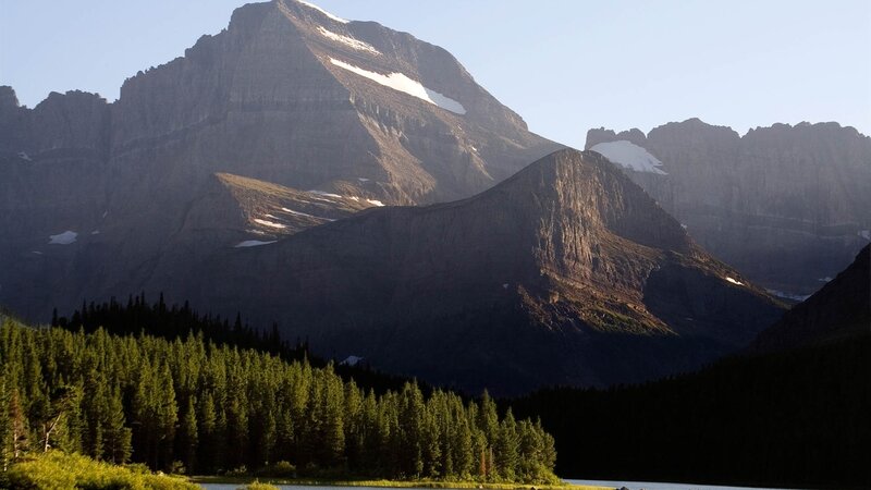 Mountain peak with forest and lake