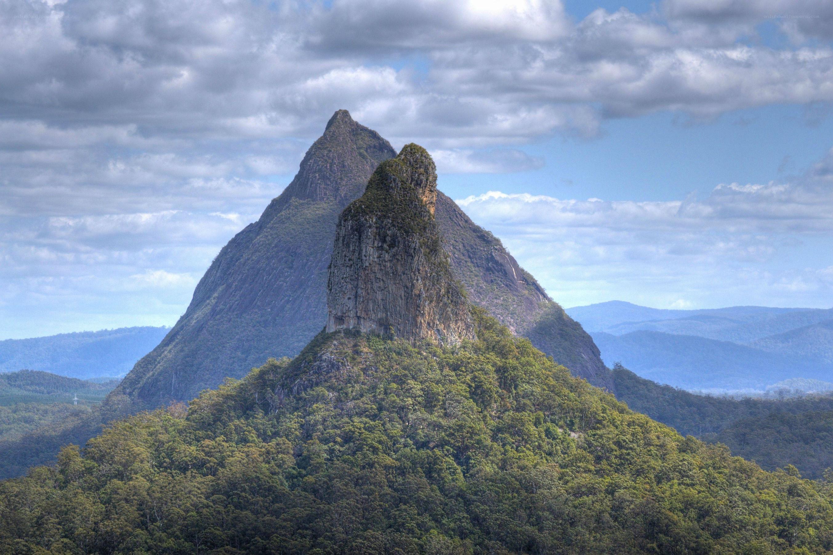 Mountain peak with forested base