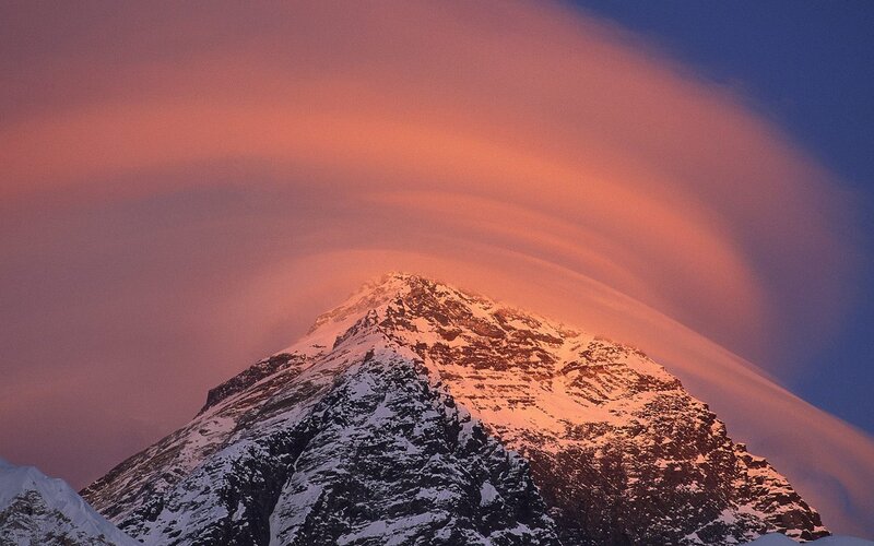 Mountain peak with lenticular cloud