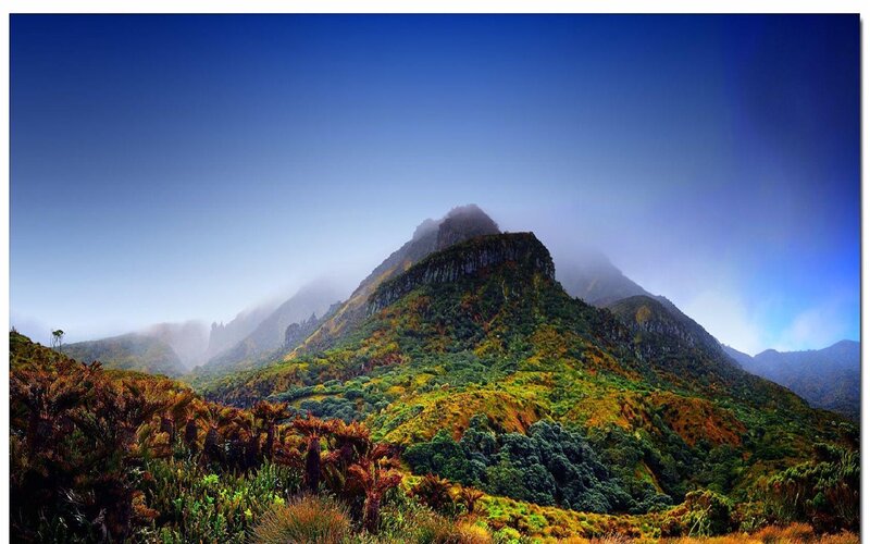 Mountain peak with misty clouds