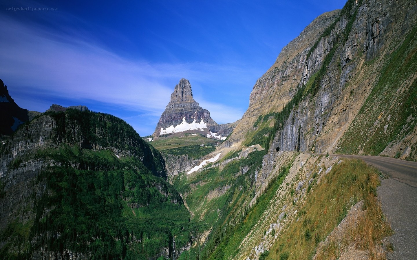 Mountain peak with road and snow