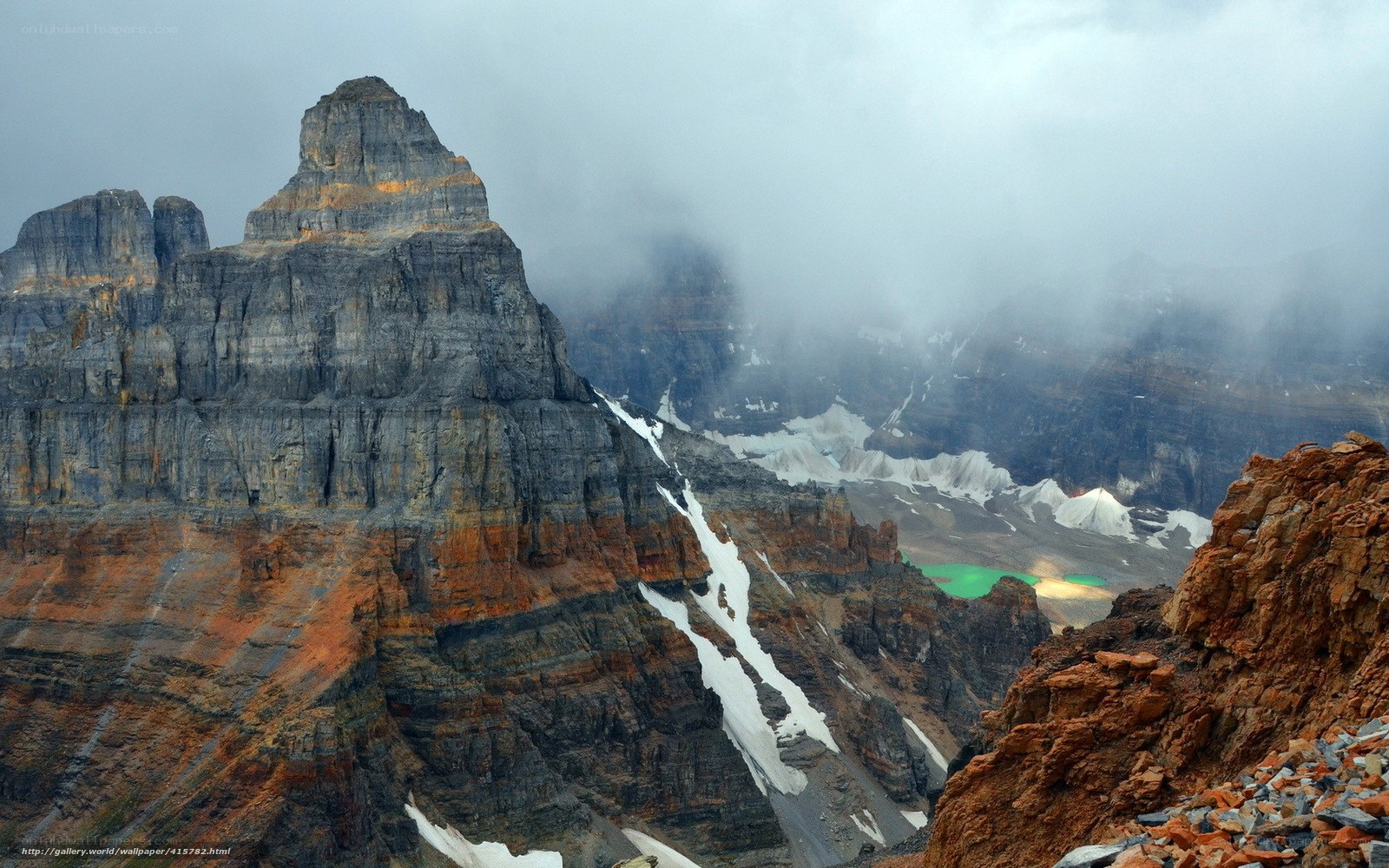 Mountain peak with snow and fog