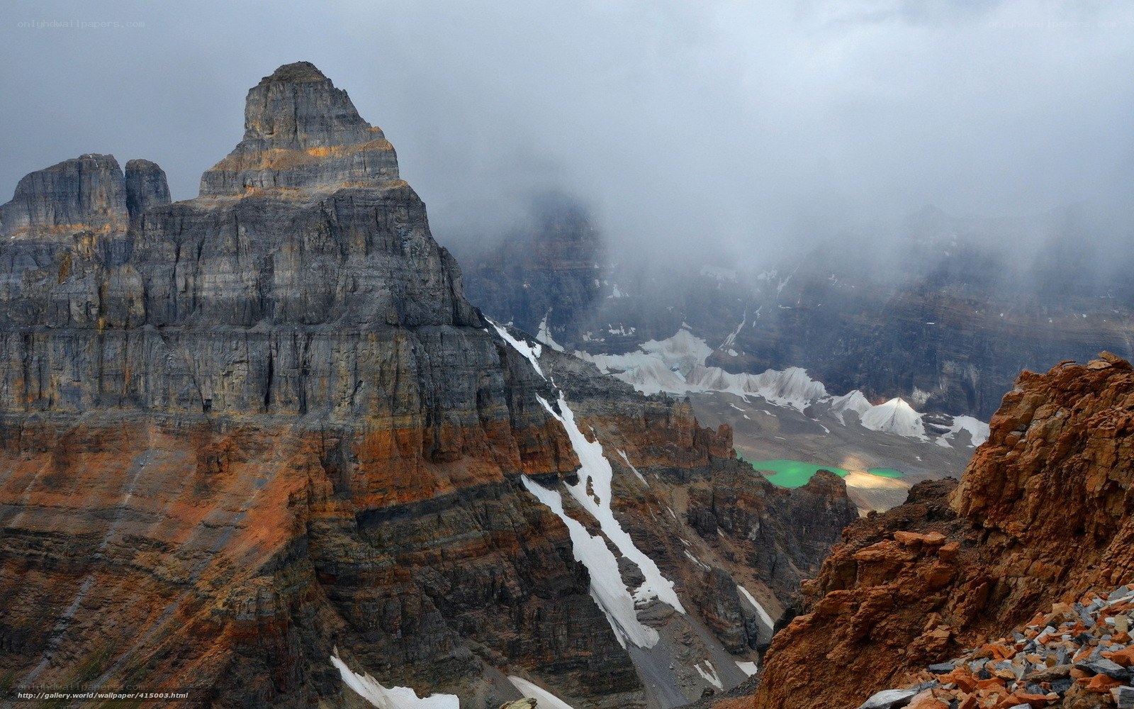 Mountain peak with snow and lake