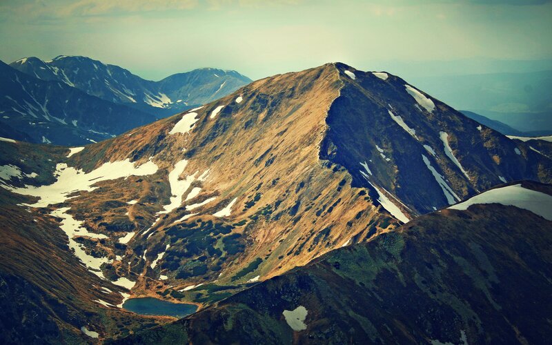 Mountain peak with snow patches