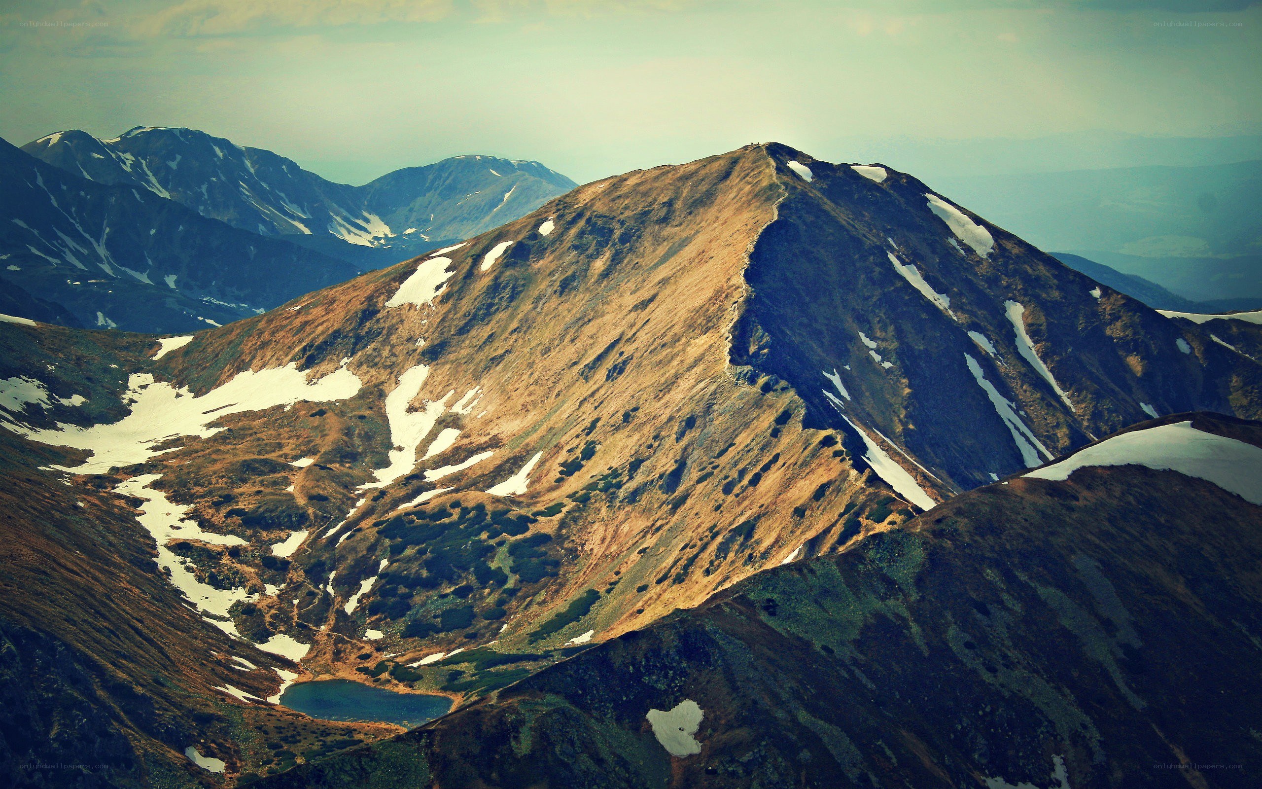 Mountain peak with snow patches