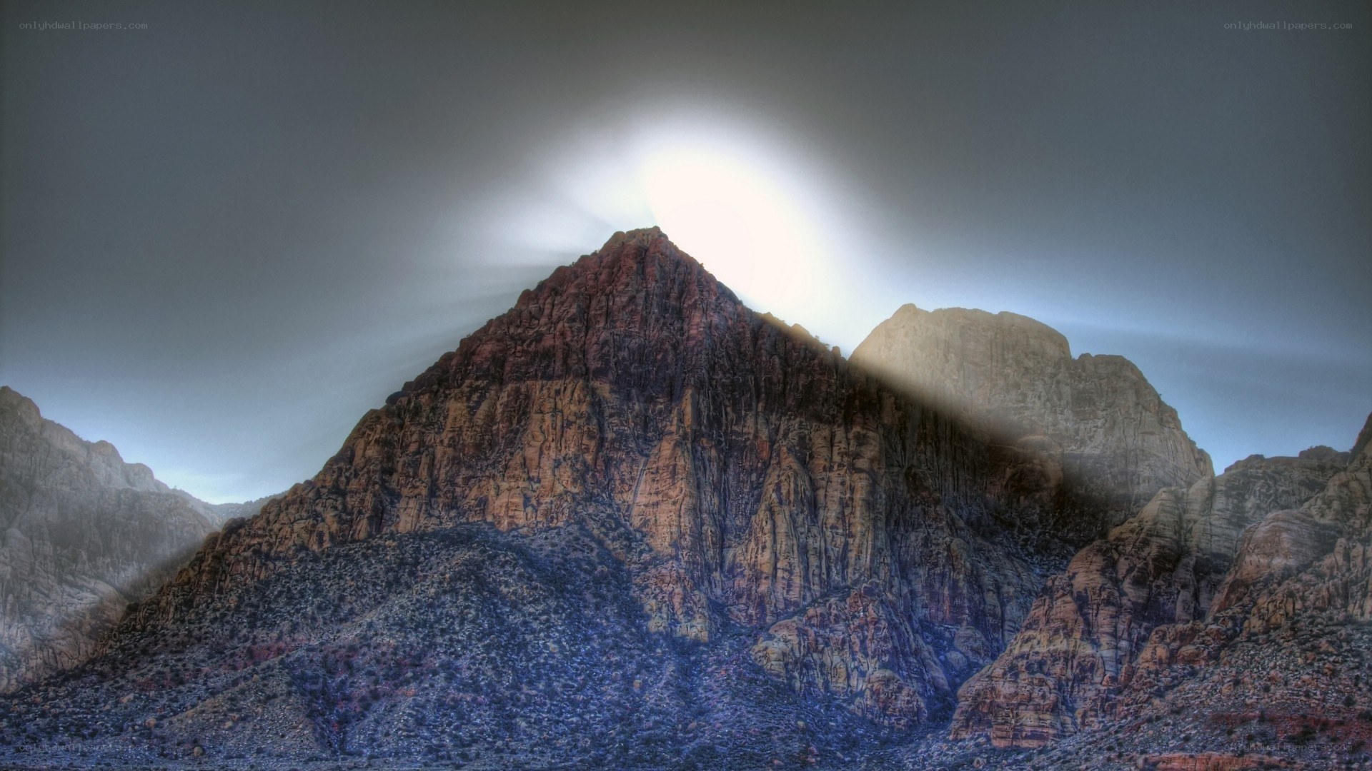 Mountain peak with sun halo