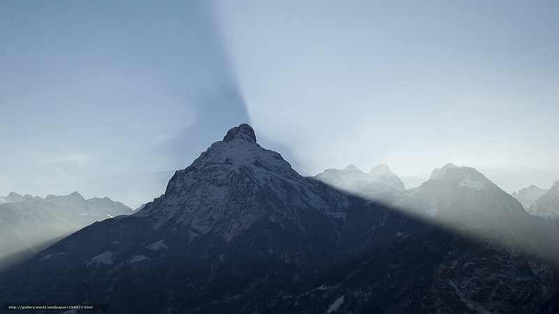 Mountain peak with sunbeams