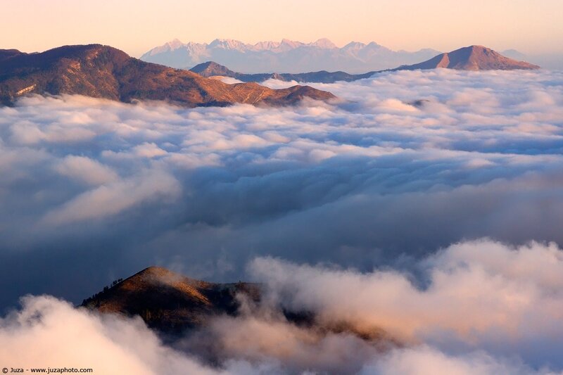 Mountain peaks above a sea of clouds