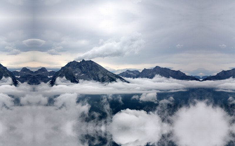 mountain peaks above clouds