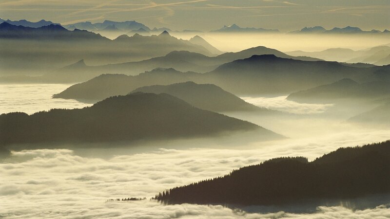 Mountain peaks above clouds