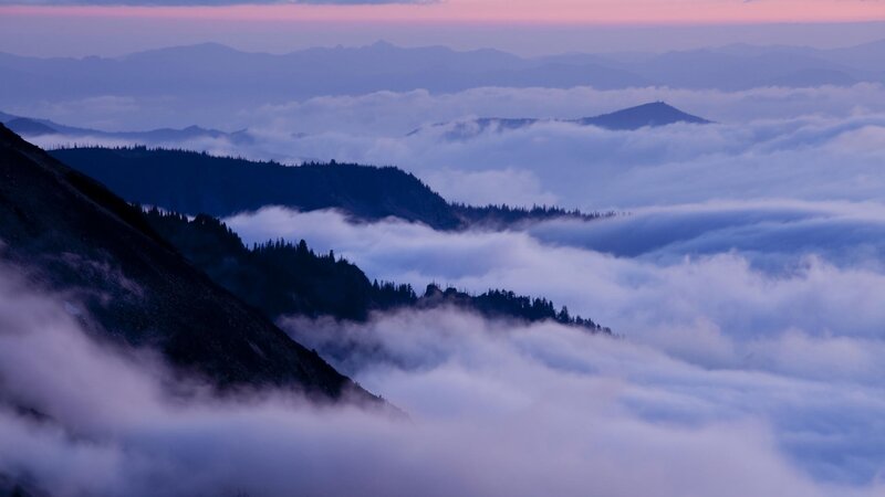 mountain peaks above clouds