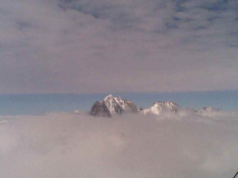 mountain peaks above clouds