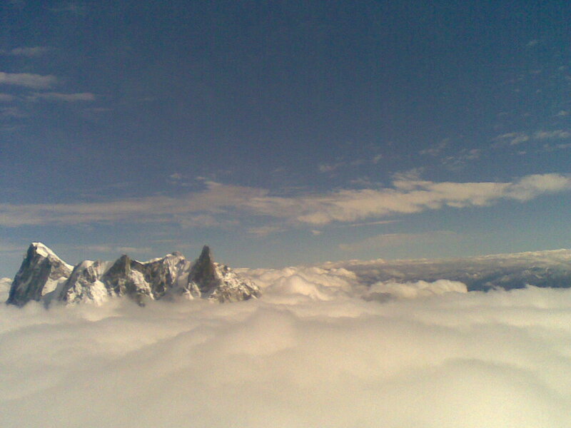 mountain peaks above clouds