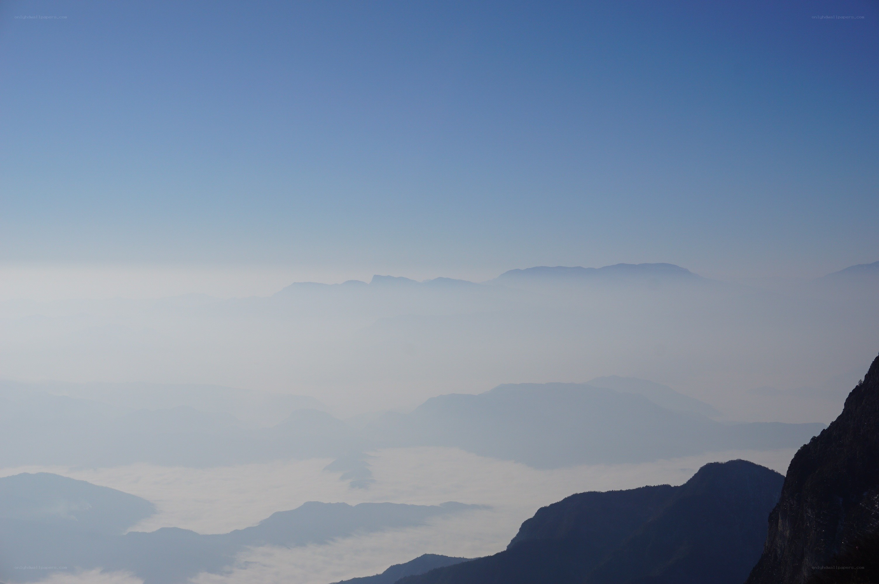 mountain peaks above clouds