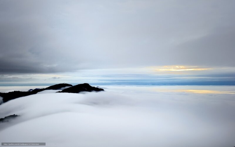 Mountain peaks above clouds