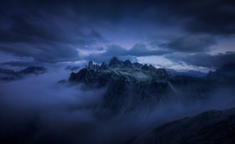 Mountain Peaks Above Clouds — Blue, Dramatic, Night, Photograph