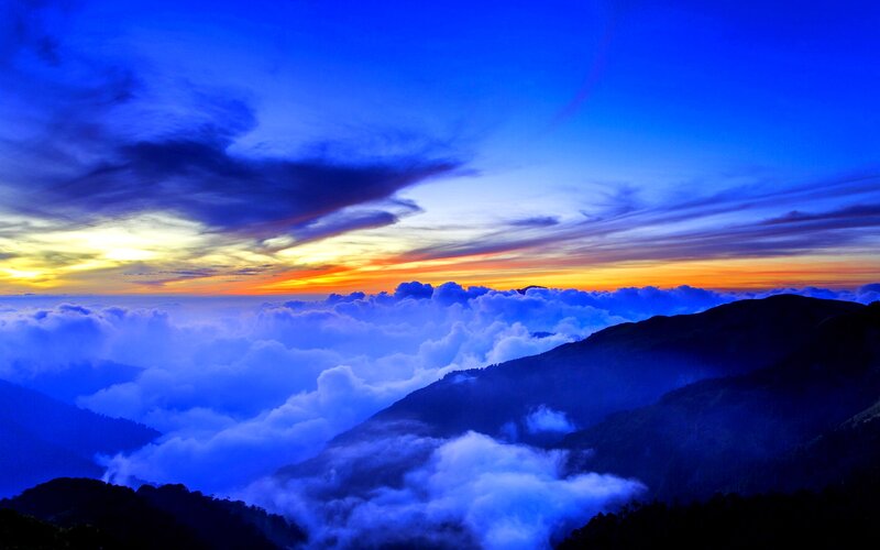 Mountain Peaks Above Clouds — Blue, Dramatic, Sunrise, Photograph, Sky