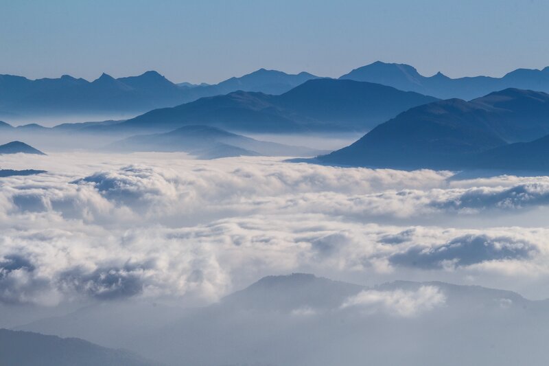 Mountain Peaks Above Clouds — Blue, Serene, Morning, Photograph, Mountains, Sky