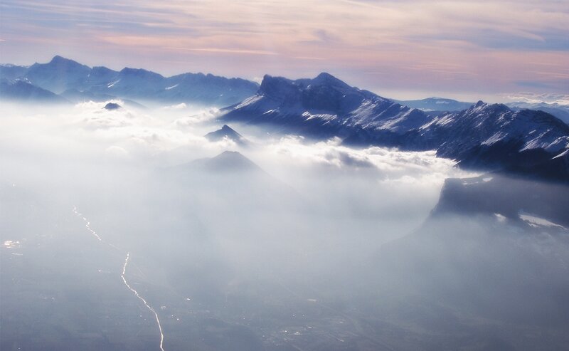 Mountain Peaks Above Clouds — Blue, Serene, Morning
