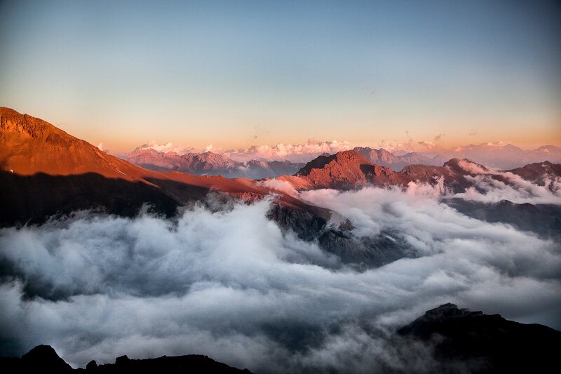 Mountain Peaks Above Clouds — Blue, Serene, Sunrise, Photograph, Mountains, Sky