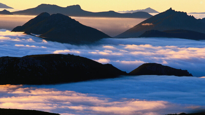 Mountain Peaks Above Clouds — Blue, Serene, Sunrise