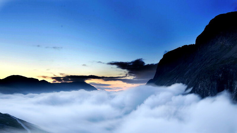 Mountain Peaks Above Clouds — Blue, Serene, Sunset
