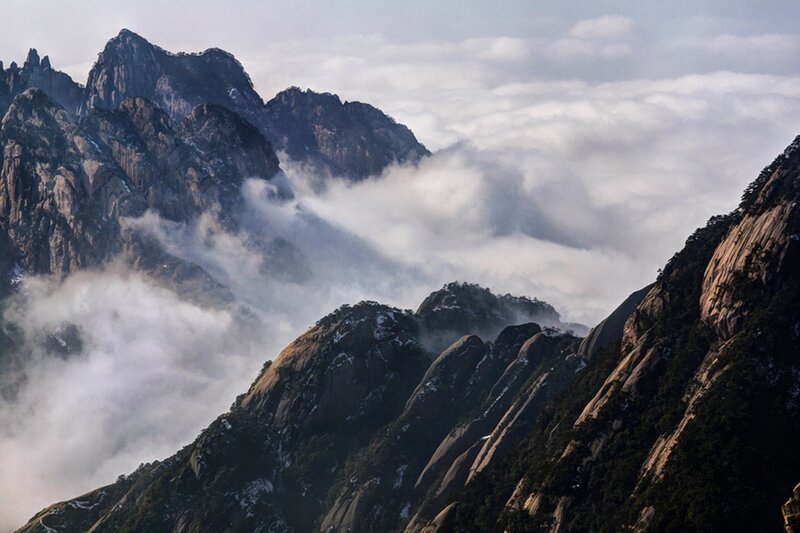 Mountain Peaks Above Clouds — Gray, Dramatic