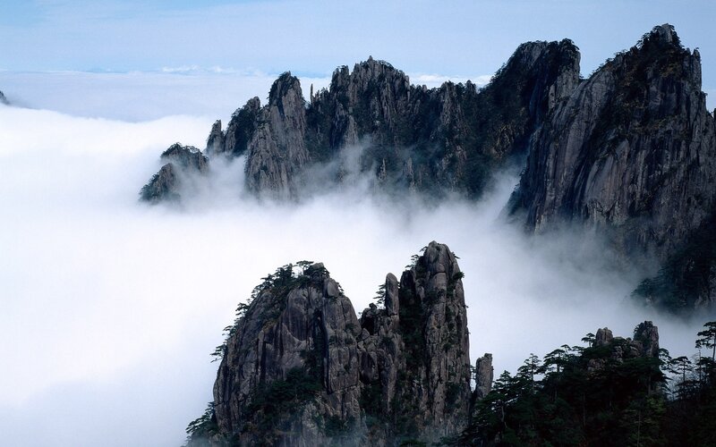 Mountain Peaks Above Clouds — Gray, Serene, Photograph